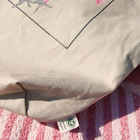Large size tote bag with a print of a roseate Spoonbill. This bright pink bird adds a splash of colour to your day! Here on a sunny day out in the sun.