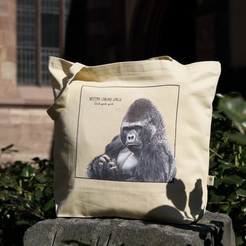 Outside photo of our organic tote bag, featuring a western lowland gorilla. Perfect as gym bag, grocery bag or any place you might need a sturdy, reusable bag!