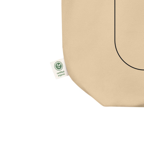 Product mockup of the sumatran orangutan organic tote bag, showing the organic label detail