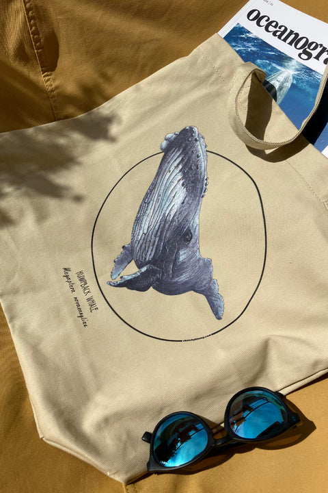 Beach day with a practical tote bag. This one shows a friendly humpback whale.