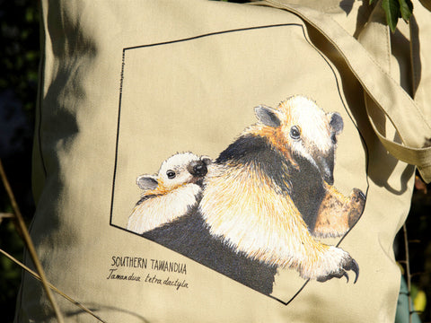 Detail of our 100% organic cotton tote bag. This one shows a print of an adorable southern tamandua with baby on the back.