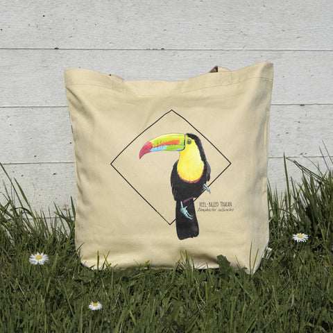 Photo of our tote bag with a keel-billed toucan in sunlight. Versatile, sturdy, this bag can be used as shopping bag, gym bag or as any everyday bag!