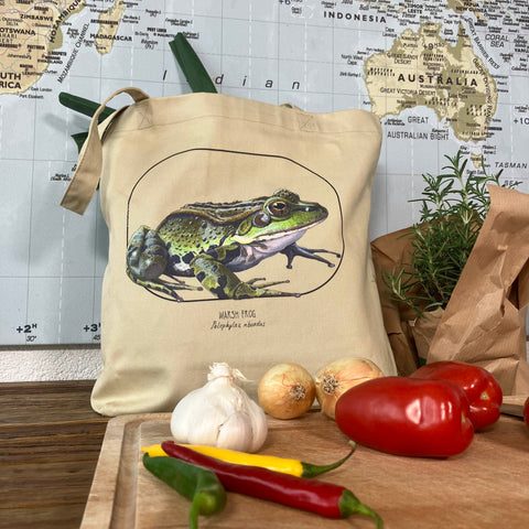 Standard size tote bag made from 100% organic cotton. This marsh frog print was lovingly hand-crafted with lots of detail. Here we use it for groceries.