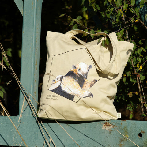 Large tote bag with a print of an adorable tamandua mom with a baby on the back. Beautiful print of a hand-drawn animal, 100% organic cotton. Here the bag shown in real-life.
