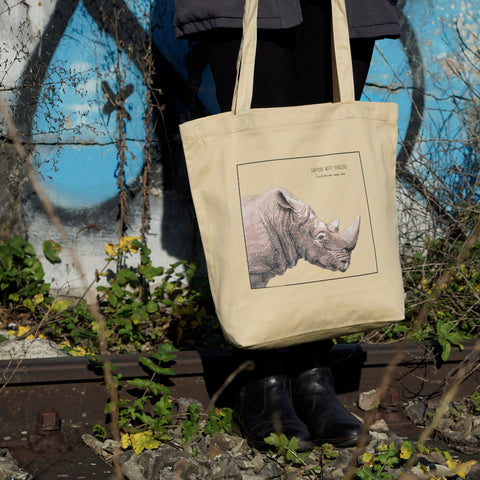 Beautiful, hand-drawn southern white rhinoceros on our organic tote bag.