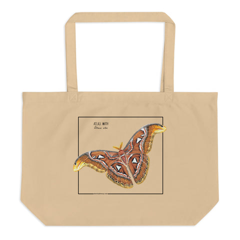 Product mockup of our large organic tote bag, featuring an atlas moth. Here seen lying on a flat surface.
