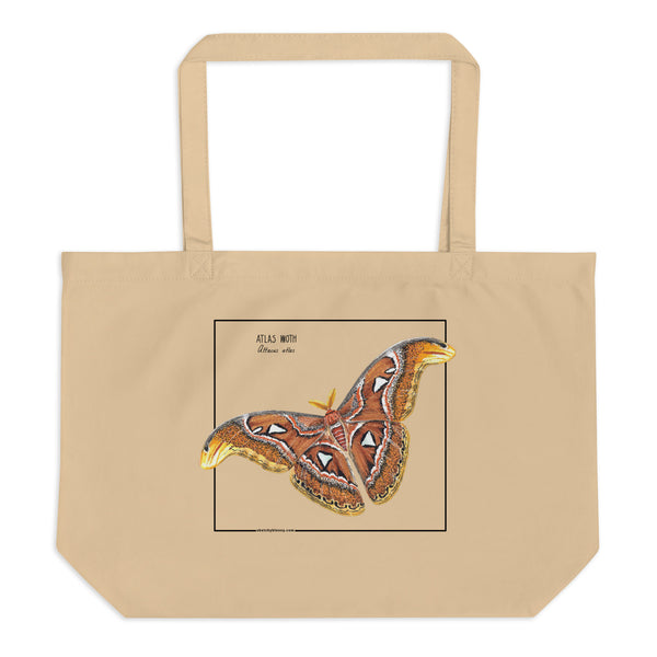 Product mockup of our large organic tote bag, featuring an atlas moth. Here seen lying on a flat surface.