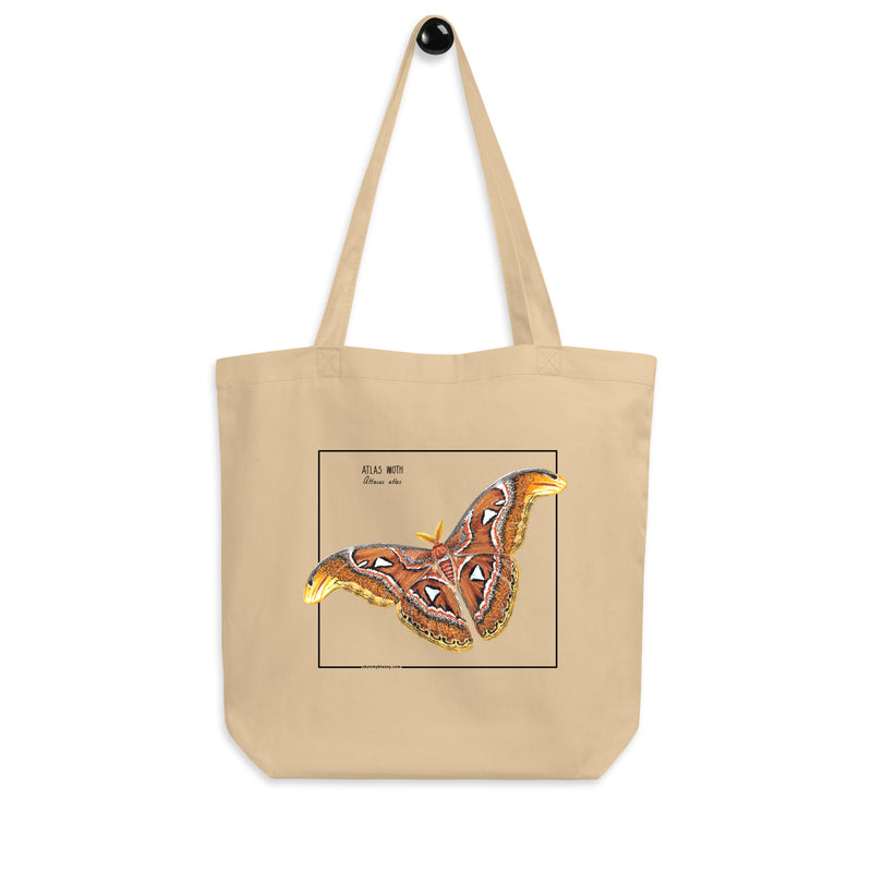 Product mockup of our atlas moth organic tote bag. Here seen hanging from the handles.