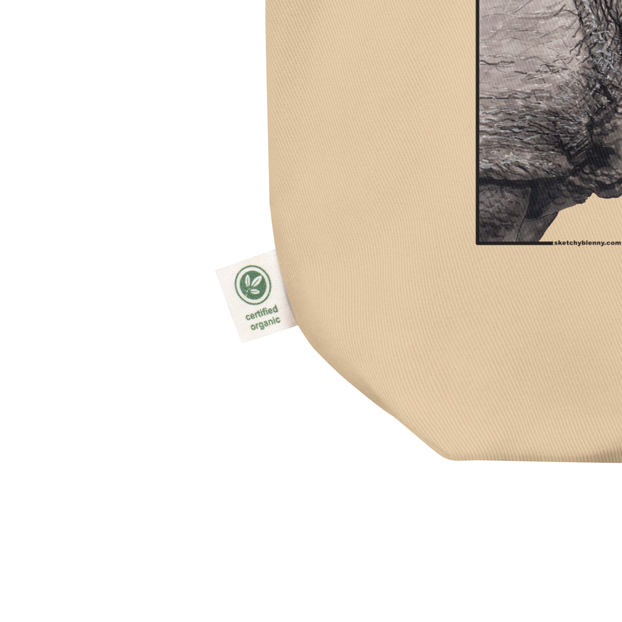 Product mockup of our tote bag with beautiful, carefully drawn southern white rhinoceros printed on the front side of the bag. Shown here is the organic label.