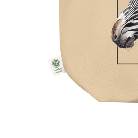 Detail of the organic label of our tote bag with a print of a hand-drawn Grévy's Zebra. 100% organic cotton. Beach bag, shopping bag, travel bag, or just as a present.