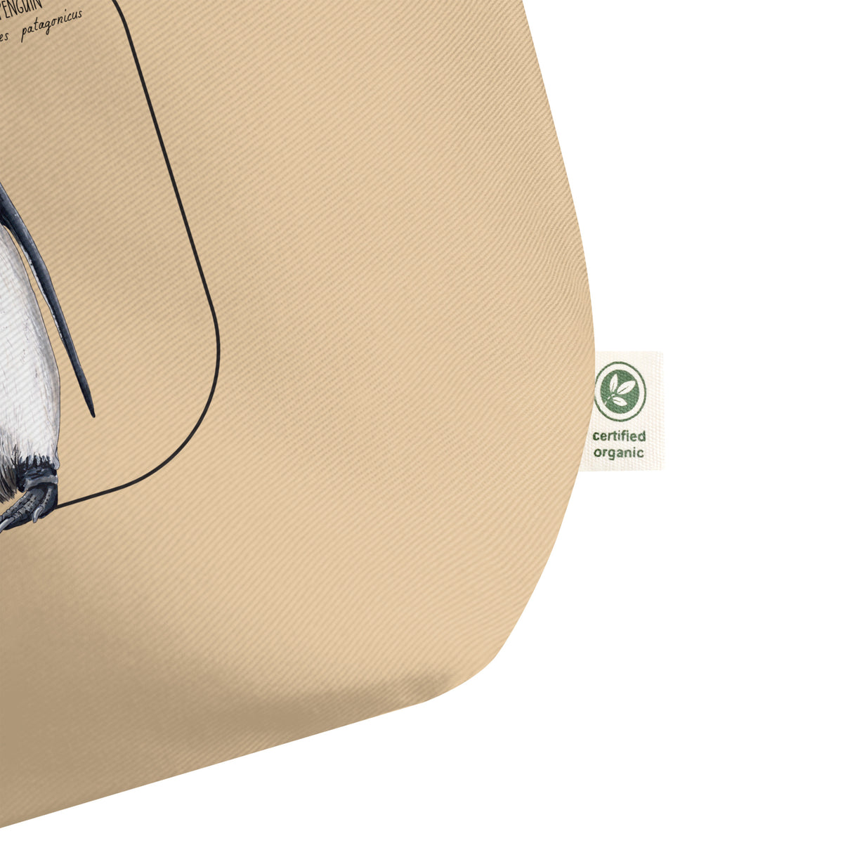 Certified organic label detail on our large and sturdy tote bag. It comes with a beautiful print of a hand-drawn pair of king penguins huddled together. 100% organic cotton. Beach bag, shopping bag, travel bag, or just as a present.