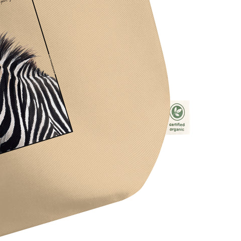 Detail of the organic label of our tote bag with a beautiful, life-like print of a hand-drawn Grévy's Zebra. 100% organic cotton. Beach bag, shopping bag, travel bag, or just as a present.