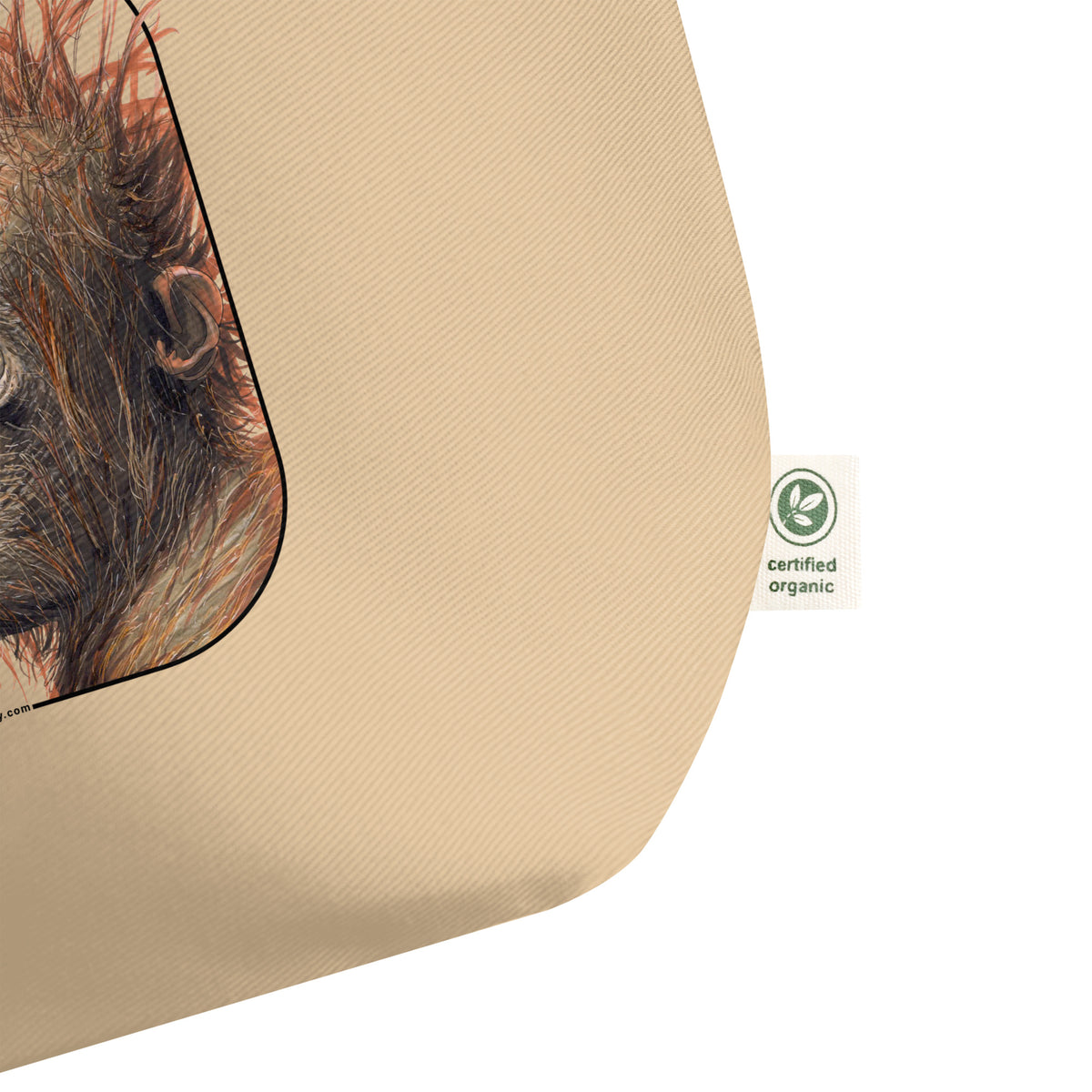 Product mockup of the large sumatran orangutan organic tote bag, lying on a flat surface.