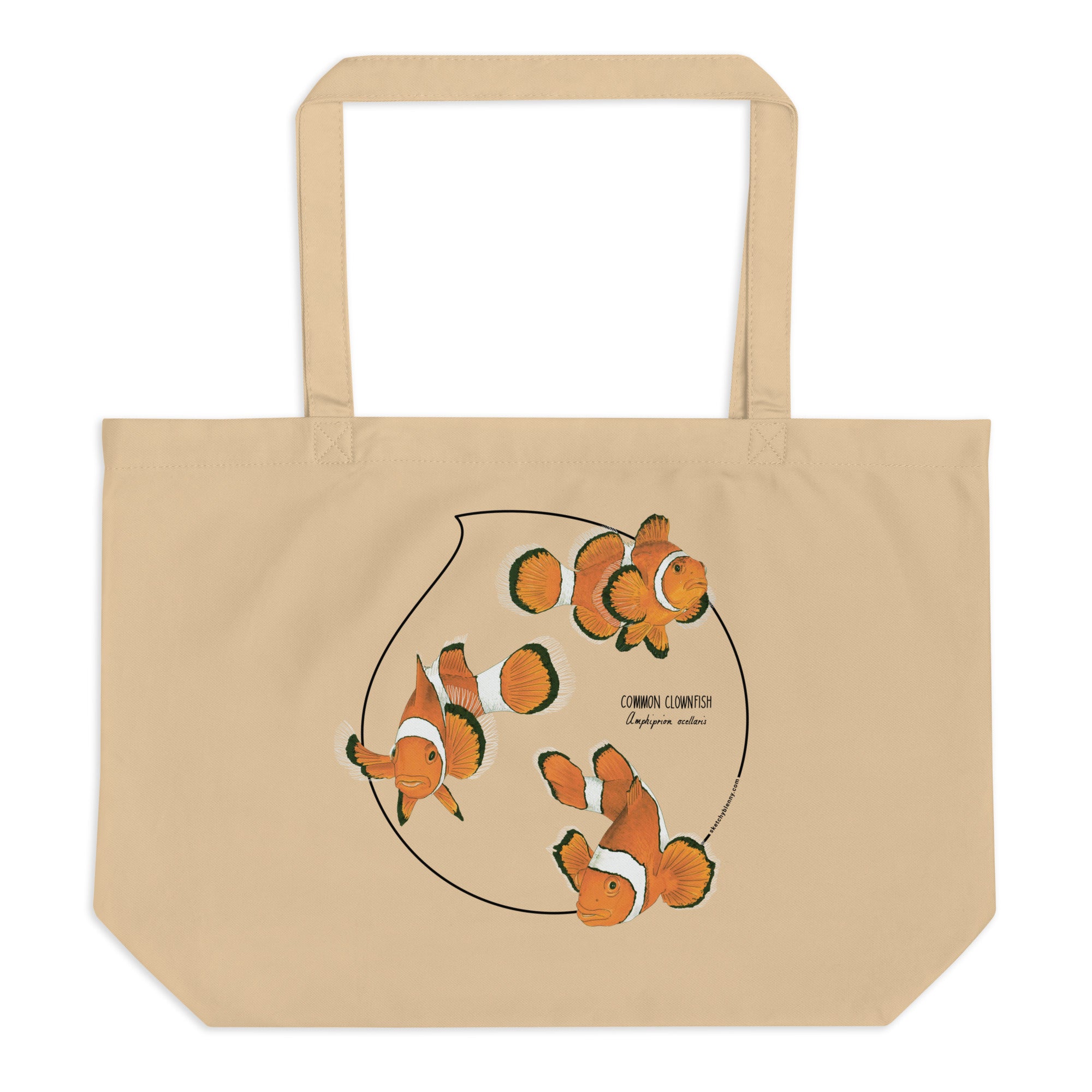 Product mockup of our large organic tote bag and a print of 3 hand-drawn common clownfishes. Here the bag lies flat on a surface.