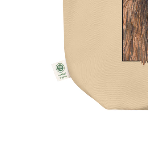 Product mockup of our 100% organic tot bag with a print of a europeant bison (wisent), detail of organic label.