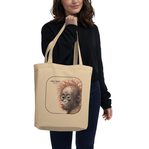 Product mockup of the sumatran orangutan organic tote bag, held by a model.