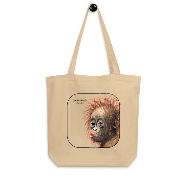 Product mockup of the sumatran orangutan organic tote bag, hanging from a holder.