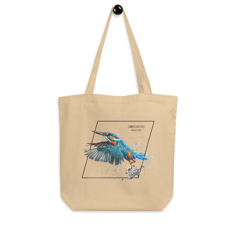 Product mockup of our Organic tote bag featuring a common kingfisher, hanging from a hanger.