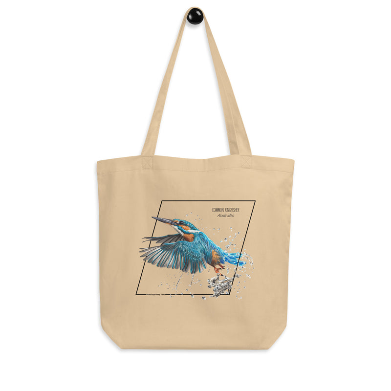Product mockup of our Organic tote bag featuring a common kingfisher, hanging from a hanger.