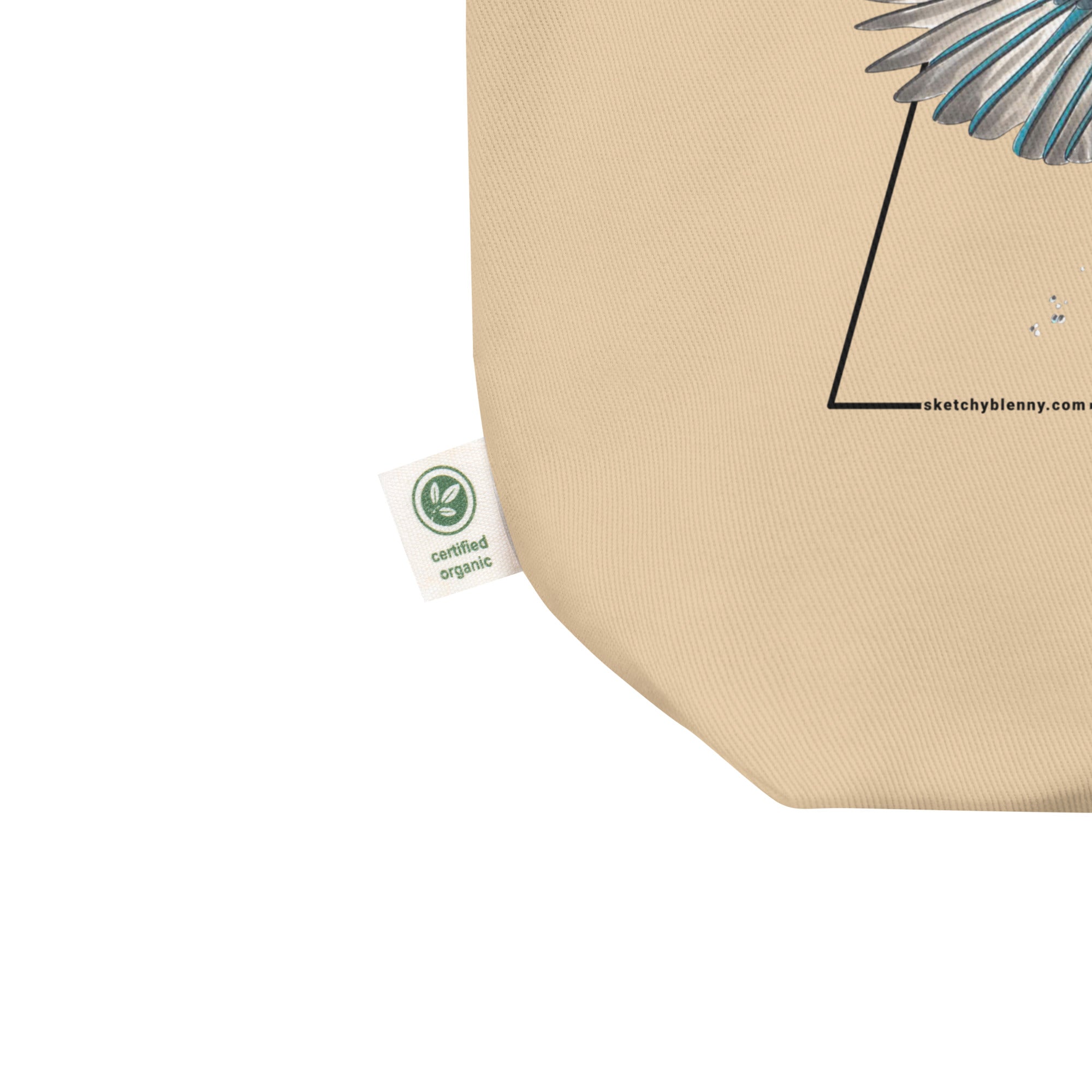 Product mockup of our Organic tote bag featuring a common kingfisher, showing the organic label.