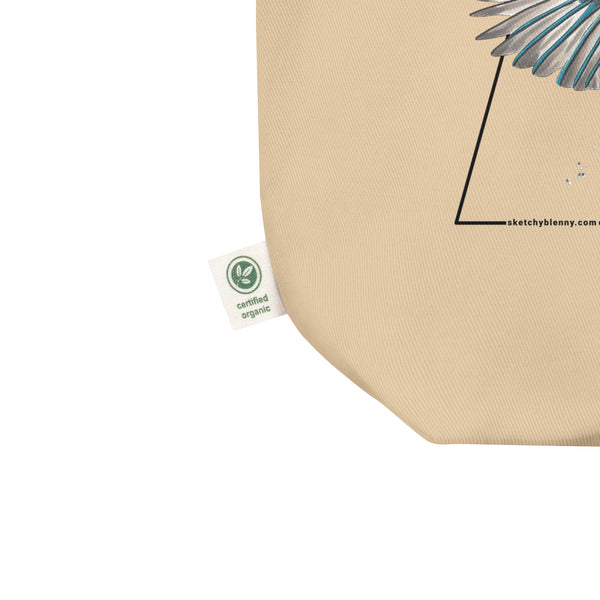 Product mockup of our Organic tote bag featuring a common kingfisher, showing the organic label.