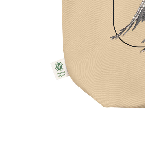 Product mockup of our 100% organic tote bag with a european green woodpecker print. Detail of the organic logo.