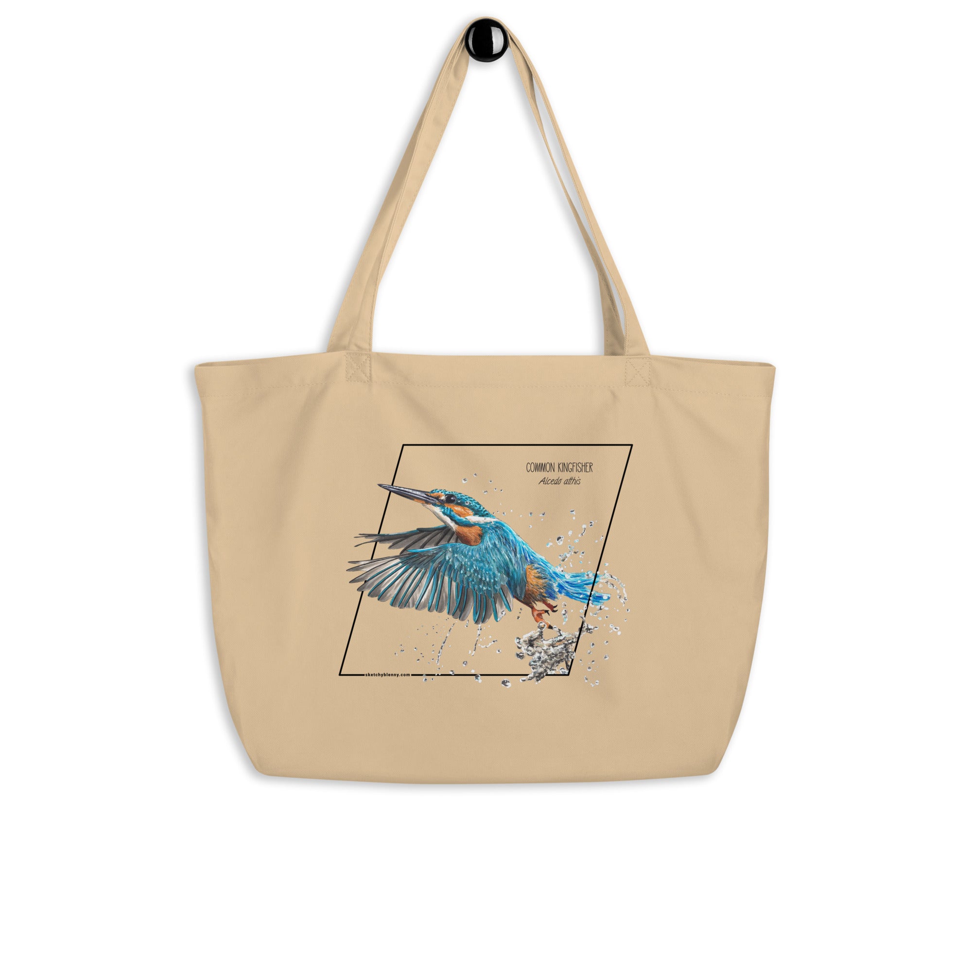 Product mockup of our large organic tote bag with a common kingfisher print. Here hanging from a wall-hanger.
