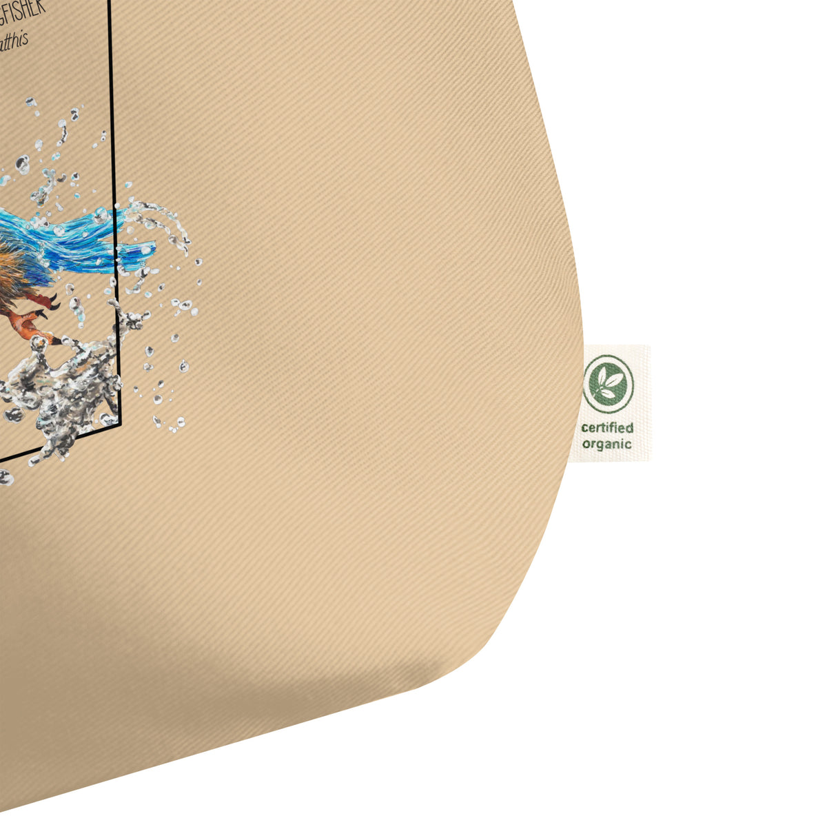 Product mockup of our large organic tote bag with a common kingfisher print. Here showing the organic label detail.