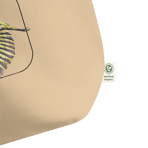Product mockup of our 100% organic tote bag with a european green woodpecker print. Here focussing on the organic logo.