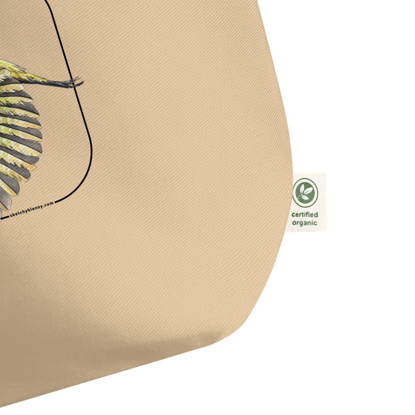 Product mockup of our 100% organic tote bag with a european green woodpecker print. Here focussing on the organic logo.