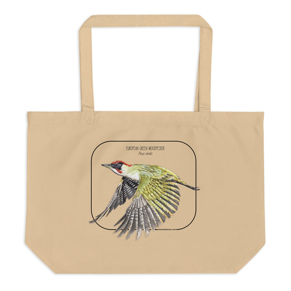 Product mockup of our 100% organic tote bag with a european green woodpecker print. Here lying flat on a white surface.