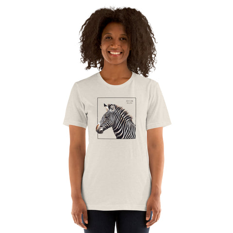 Product mockup of a female model wearing the very comfortable grévy's zebra t-shirt in the colour heather dust.