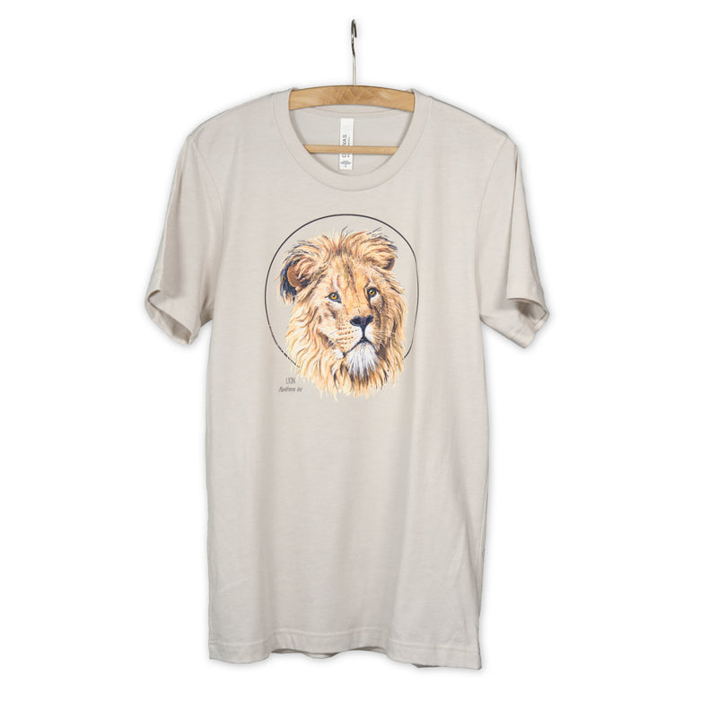 Photo of our lion t-shirt in the colour heather dust on a wooden hanger.