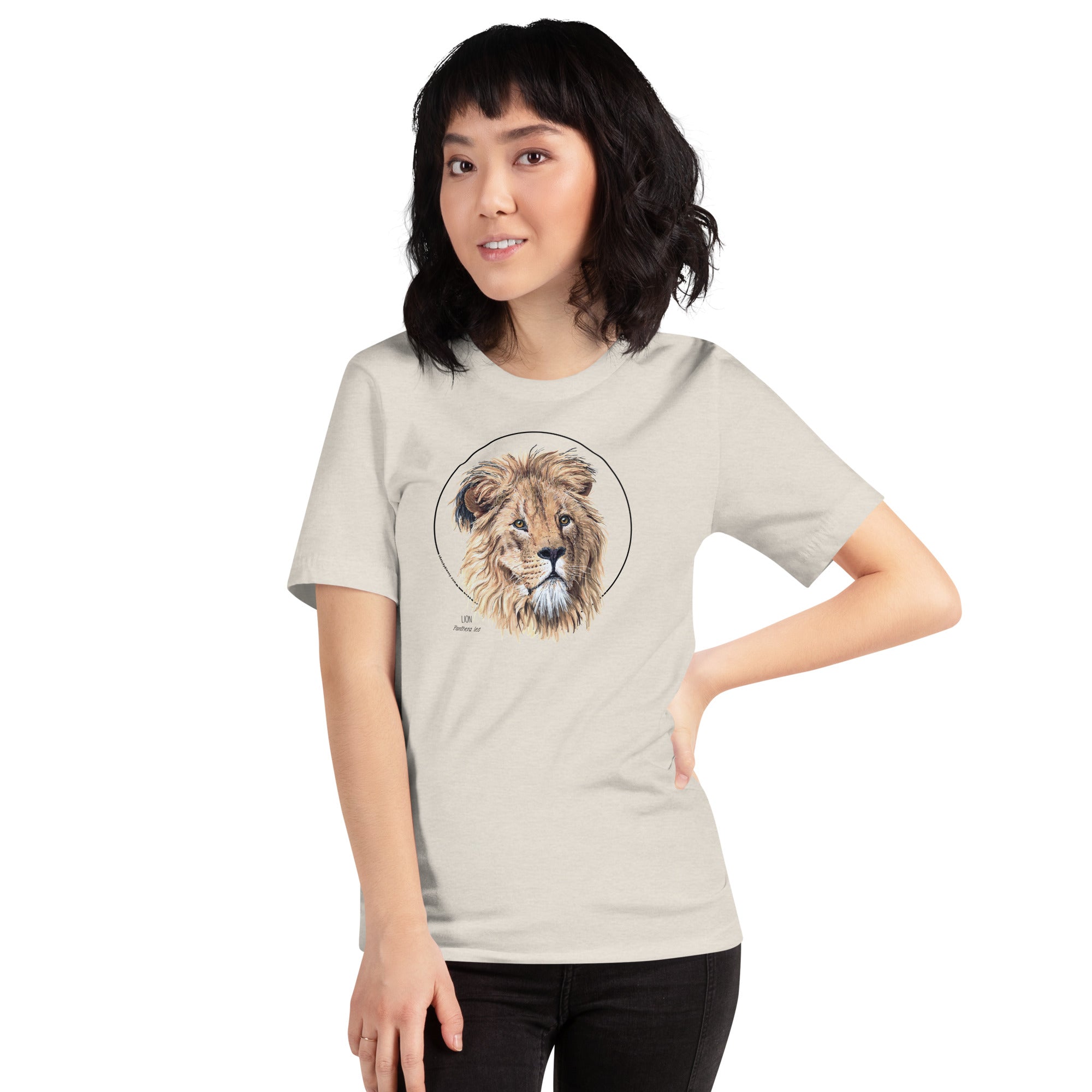 Product mockup of our lion print t-shirt, worn by a female model. This shirt's base colour is heather dust.
