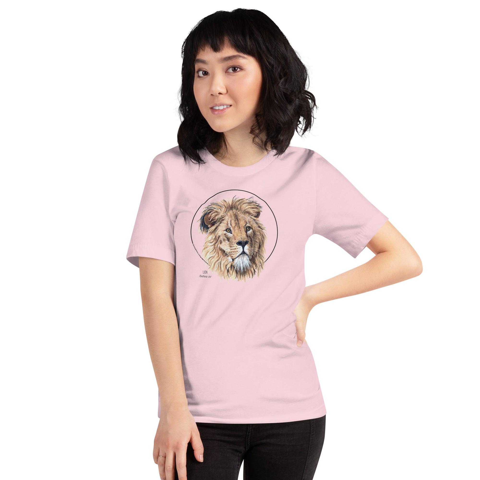Product mockup of our lion print t-shirt, worn by a female model. This shirt's base colour is soft pink.