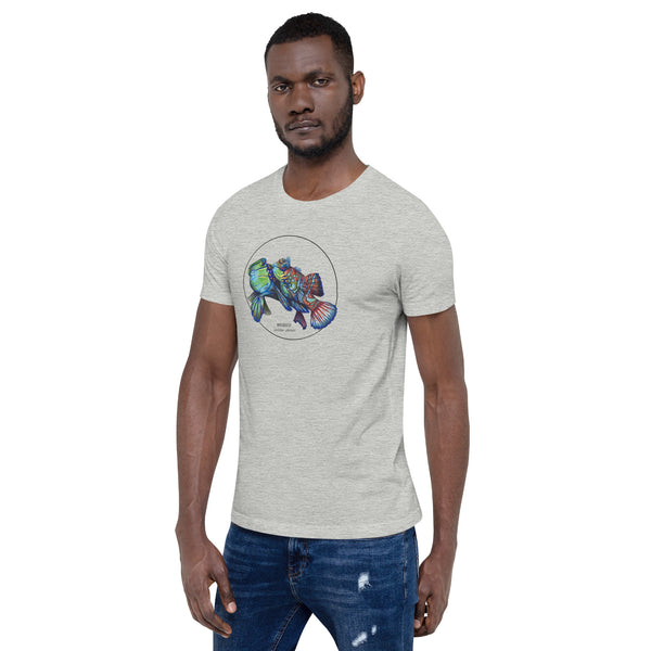Product mockup showing a male model wearing the t-shirt with a colourful print of two mandarinfish in courtship. Base colour of the shirt is athletic heather.