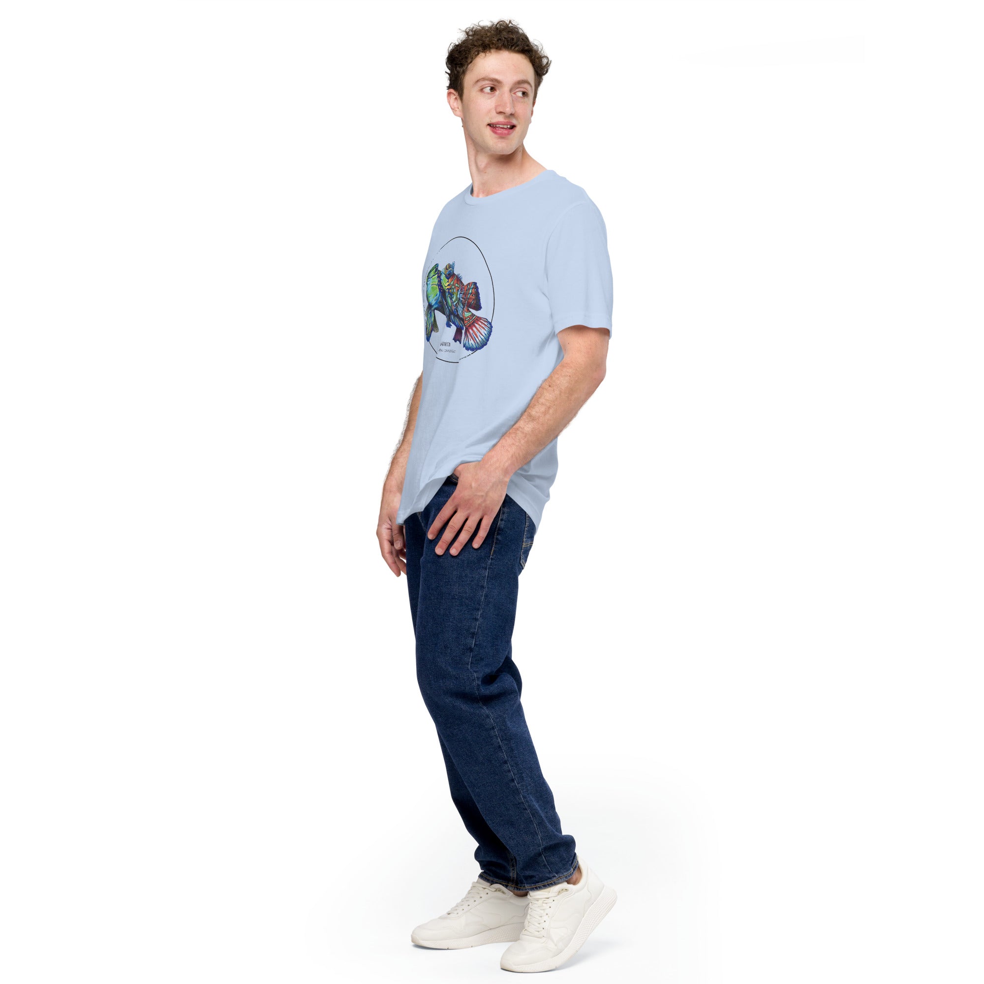 Product mockup showing a male model wearing the t-shirt with a colourful print of two mandarinfish in courtship. Base colour of the shirt is baby blue.