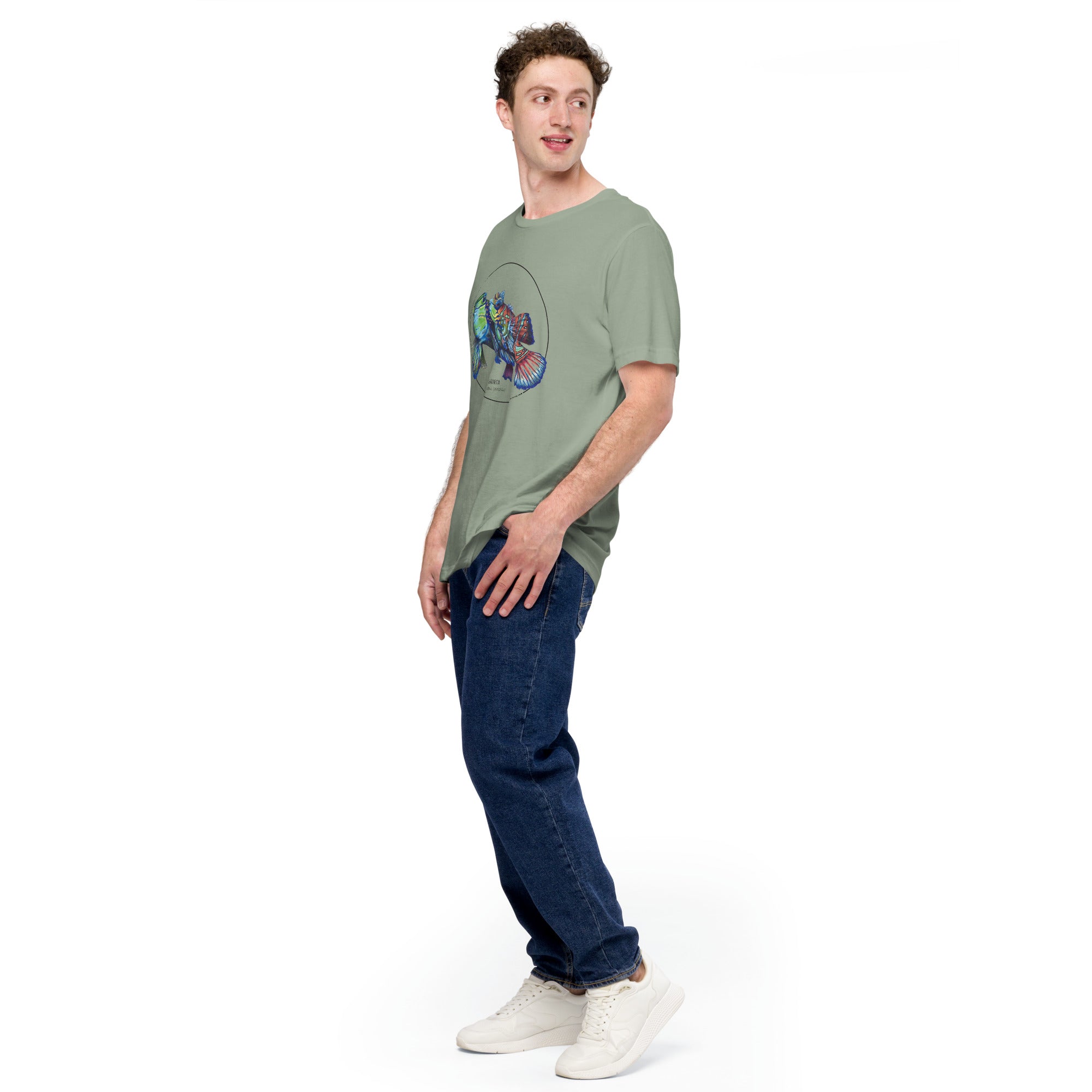 Product mockup showing a male model wearing the t-shirt with a colourful print of two mandarinfish in courtship. Base colour of the shirt is sage.
