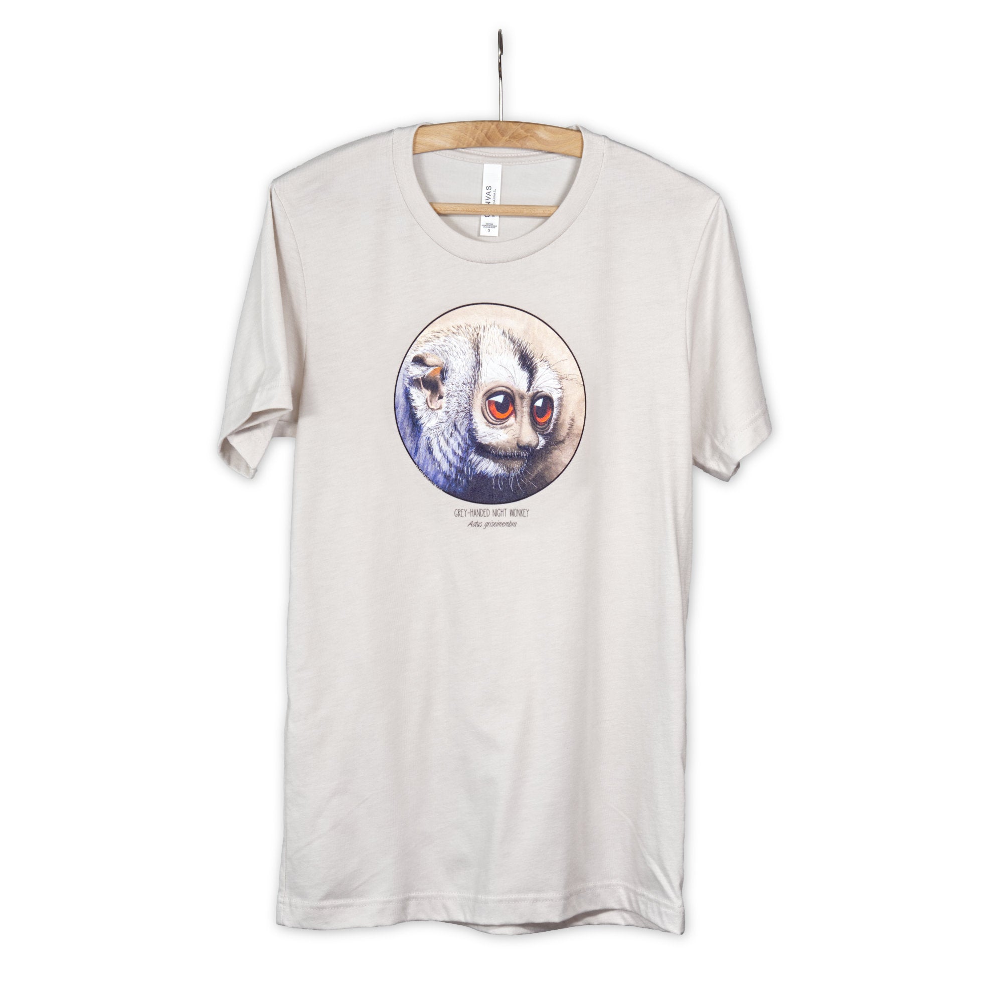 Product photo of our cheeky night monkey t-shirt on a wooden hanger. Heather dust base colour.