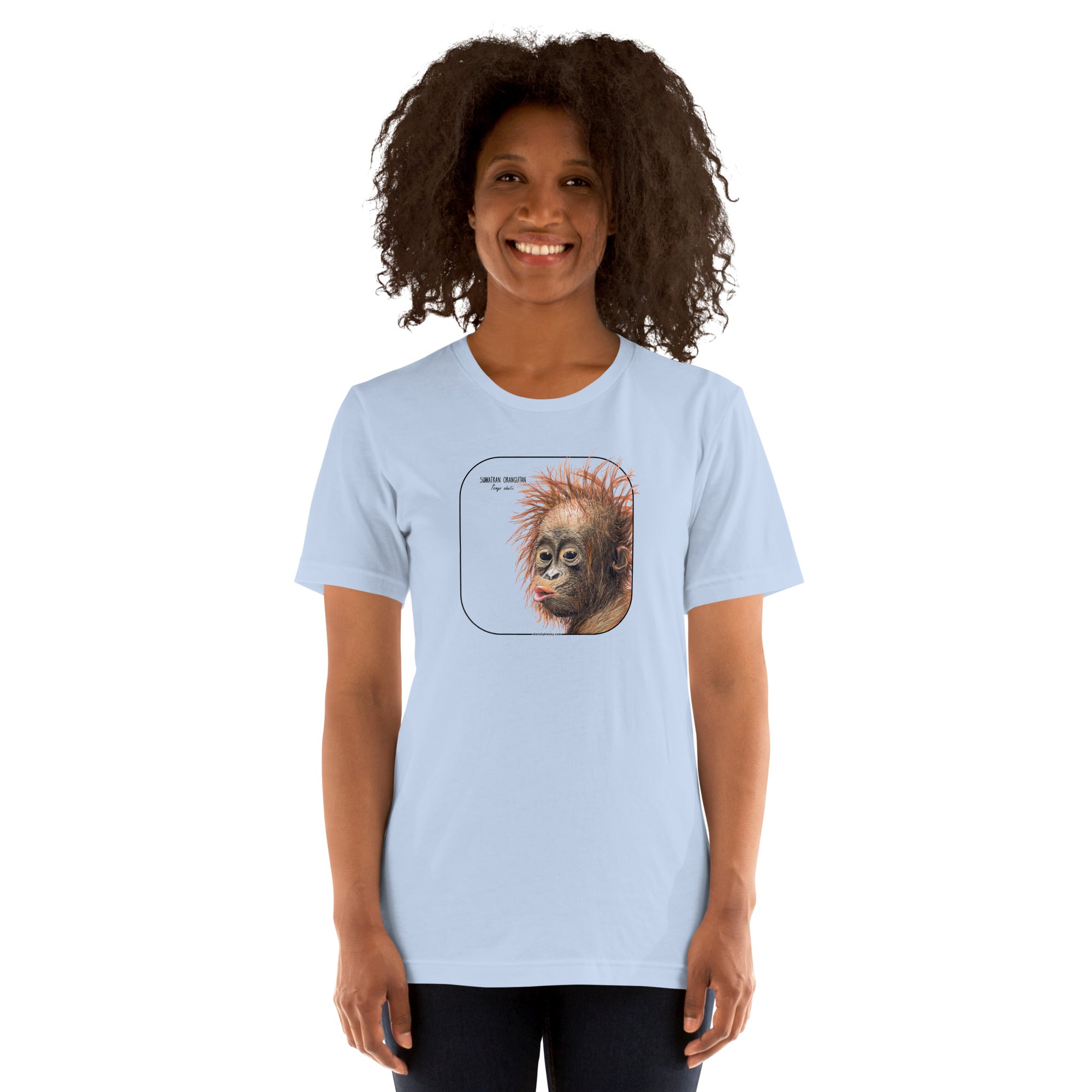 Product mockup showing a female model wearing a t-shirt with a cheeky young sumatran orangutan print. The shirt base colour is baby blue.
