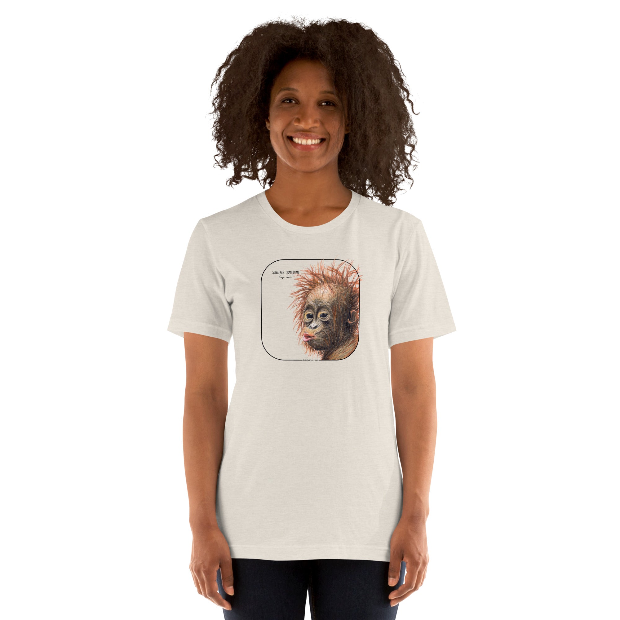Product mockup showing a female model wearing a t-shirt with a cheeky young sumatran orangutan print. The shirt base colour is heather dust.