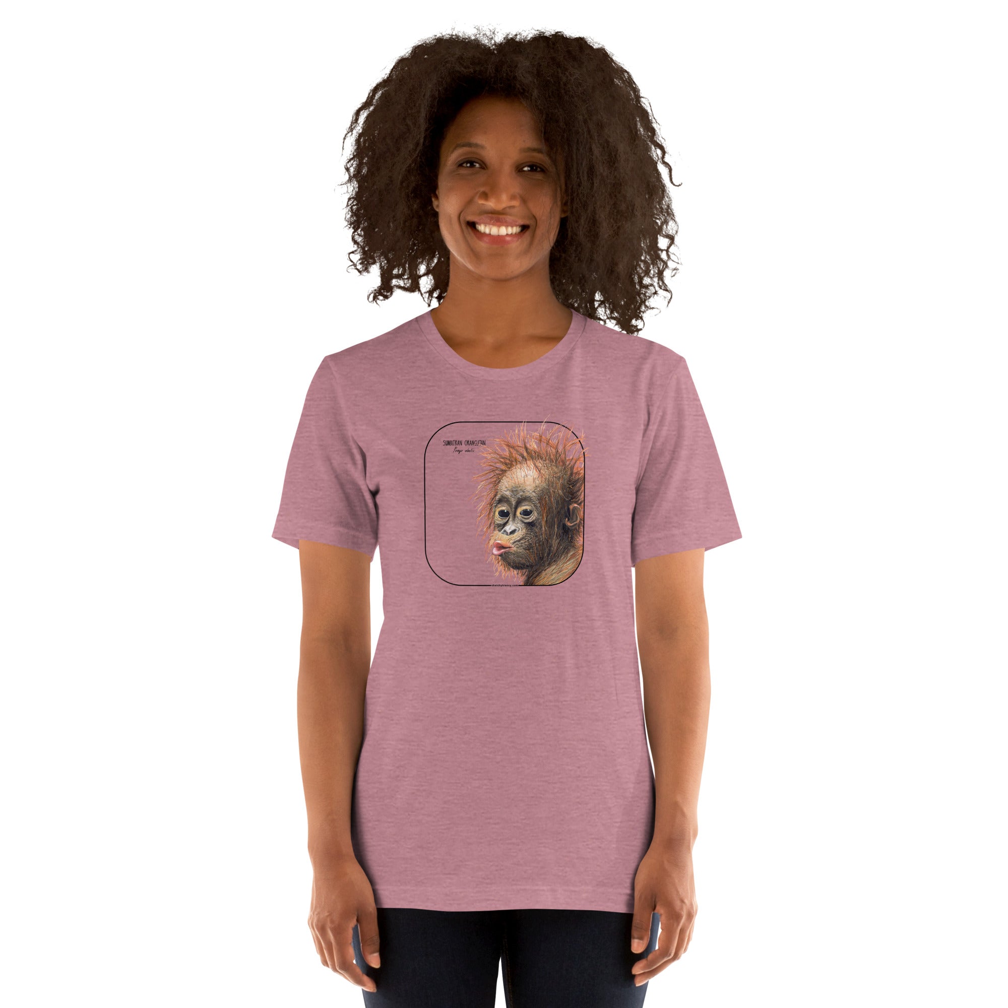 Product mockup showing a female model wearing a t-shirt with a cheeky young sumatran orangutan print. The shirt base colour is heather orchid.