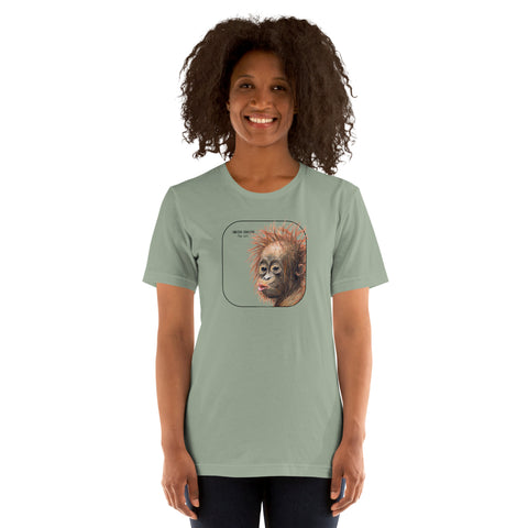 Product mockup showing a female model wearing a t-shirt with a cheeky young sumatran orangutan print. The shirt base colour is sage.