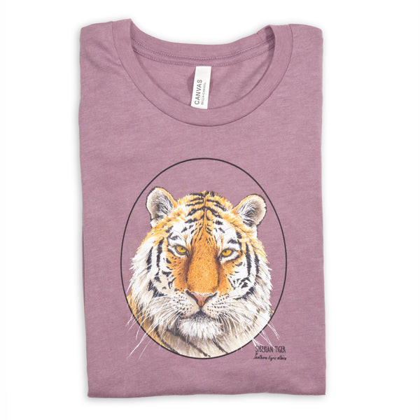 Photo of our t-shirt with a siberian tiger print on a heather orchid coloured fabric. Lying folded on a white surface.