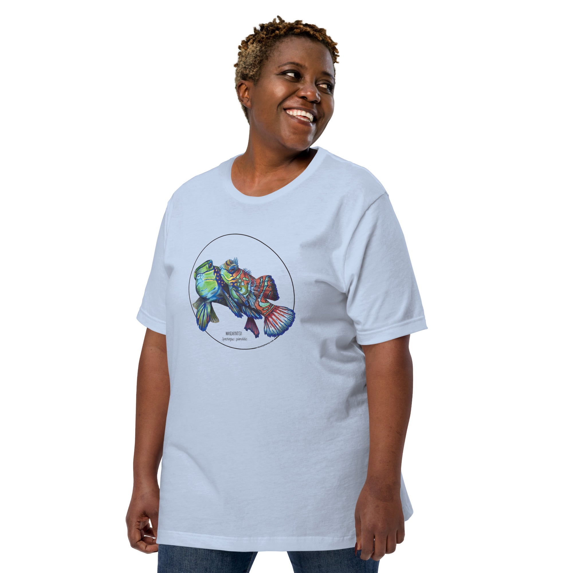 Product mockup showing a female model wearing the bigger-sized t-shirt with a colourful print of two mandarinfish in courtship. Base colour of the shirt is baby blue.