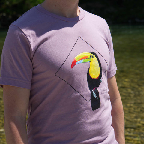 Photoshoot outside on a male model of the keel-billed toucan t-shirt in heather orchid colour.