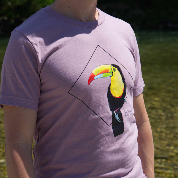 Photoshoot outside on a male model of the keel-billed toucan t-shirt in heather orchid colour.