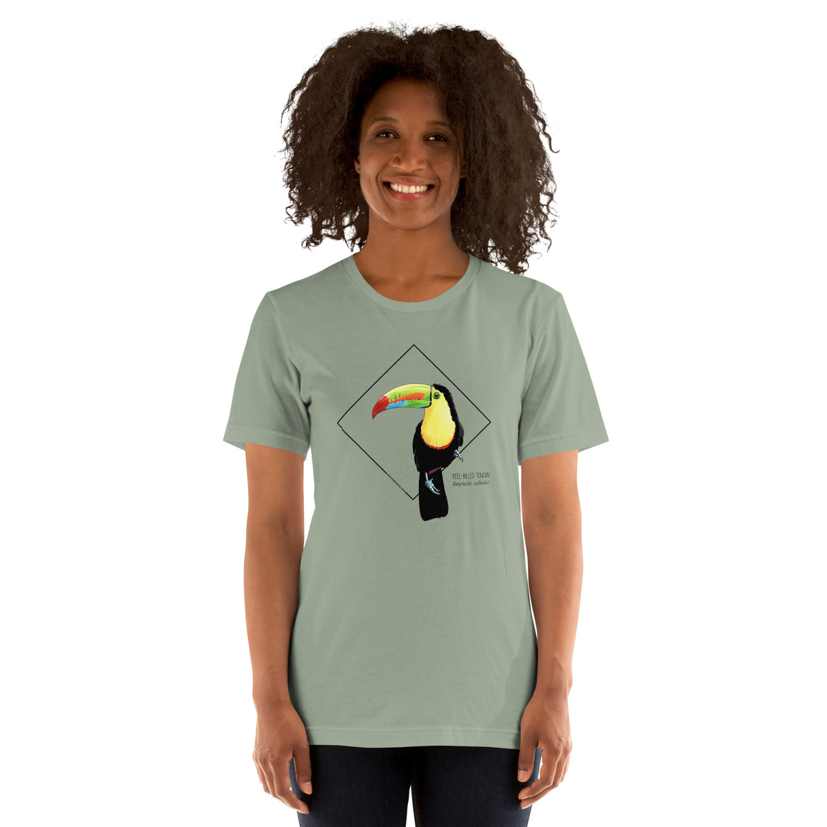 Product mockup showing a female model wearing the keel-billed toucan shirt in the colour sage.