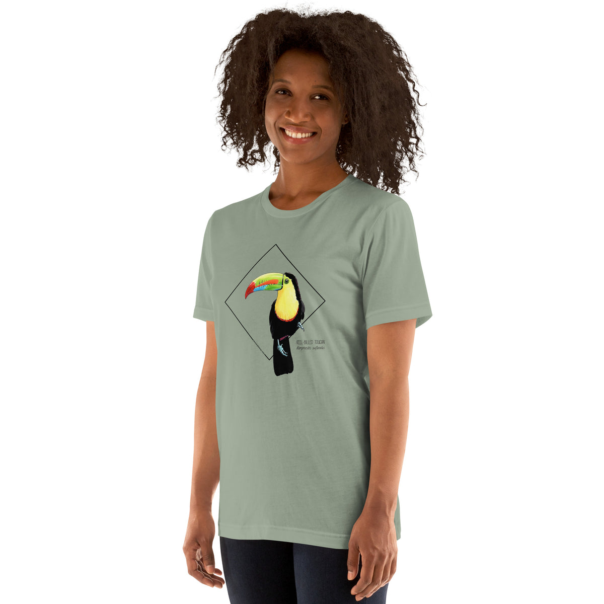 Product mockup showing a female model wearing the keel-billed toucan shirt in the colour sage.