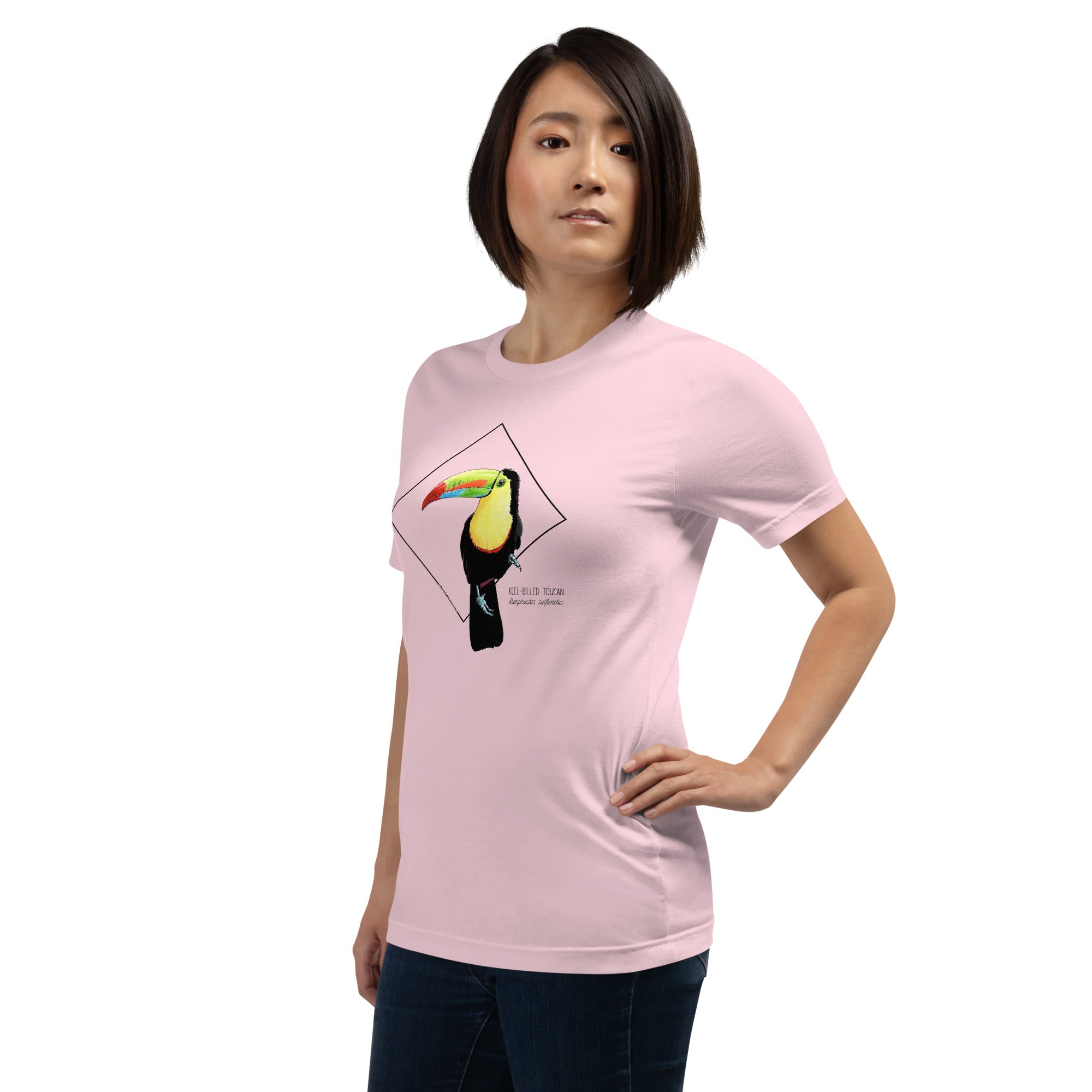 Product mockup showing a female model wearing the keel-billed toucan shirt in the colour soft pink.